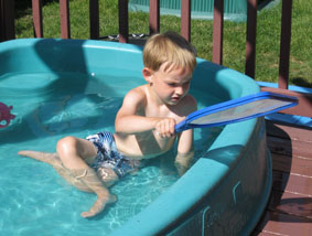 Benji cleaning the pool