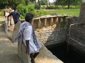 farmer at well